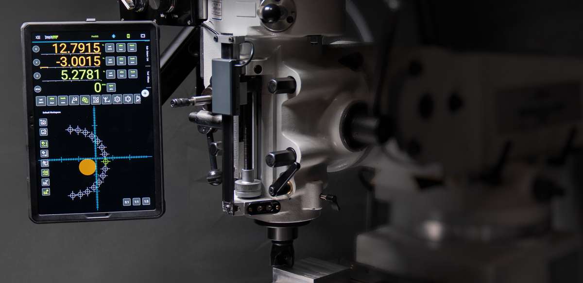 TouchDRO running on a tablet mounted to a Bridgeport-style milling machine, displaying a hole-circle drilling pattern