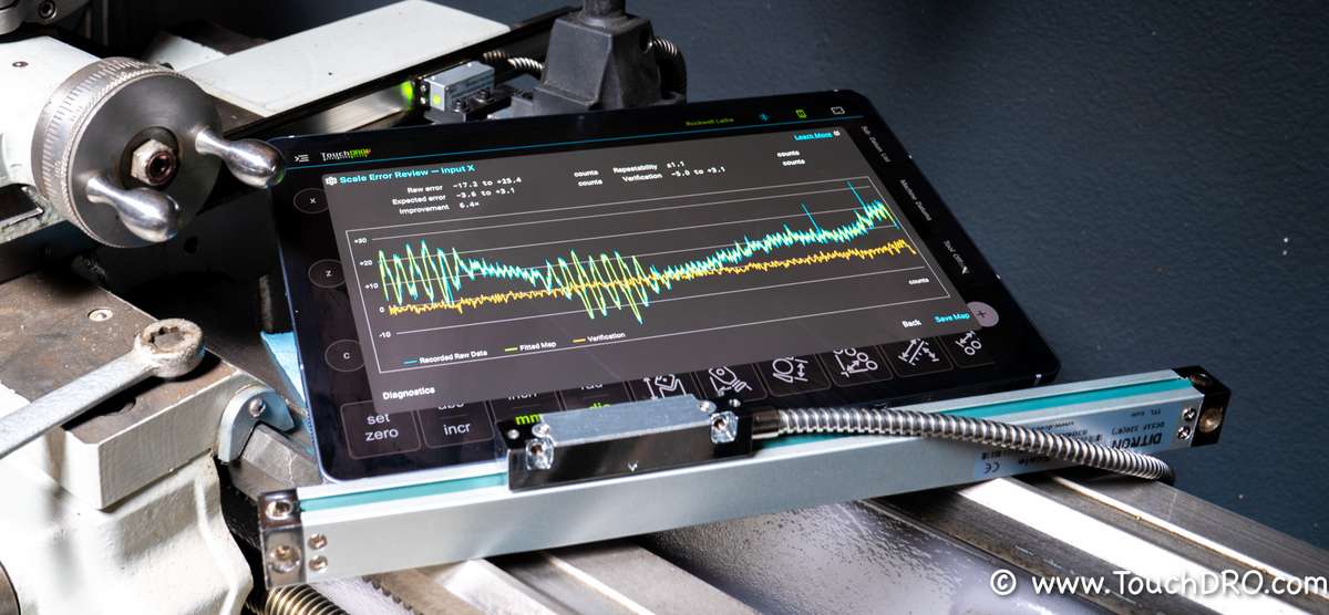 Creating a magnetic scale error map with TouchDRO and a glass scale TouchDRO tablet showing the Scale Error Review screen on a lathe, with a glass reference scale clamped in front of the magnetic cross slide scale being calibrated