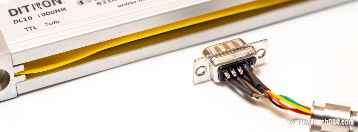 Ditron-branded single-ended DRO scale DB-9 connector opened up, showing four wires soldered to pins 2, 6, 7, and 8