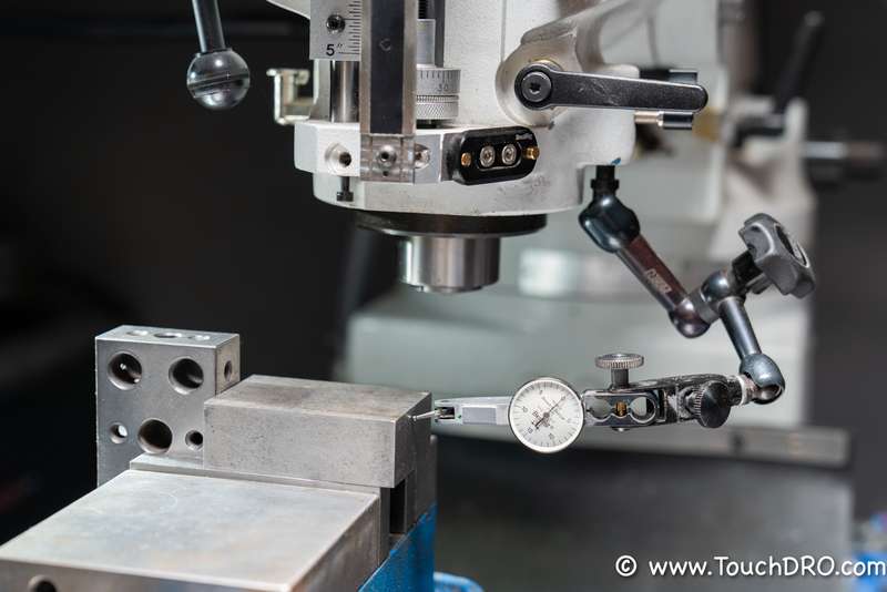 The basic accuracy check setup: two 1-2-3 blocks and a tenths indicator Two 1-2-3 blocks and a tenths test indicator set up on a mill to check DRO scale accuracy