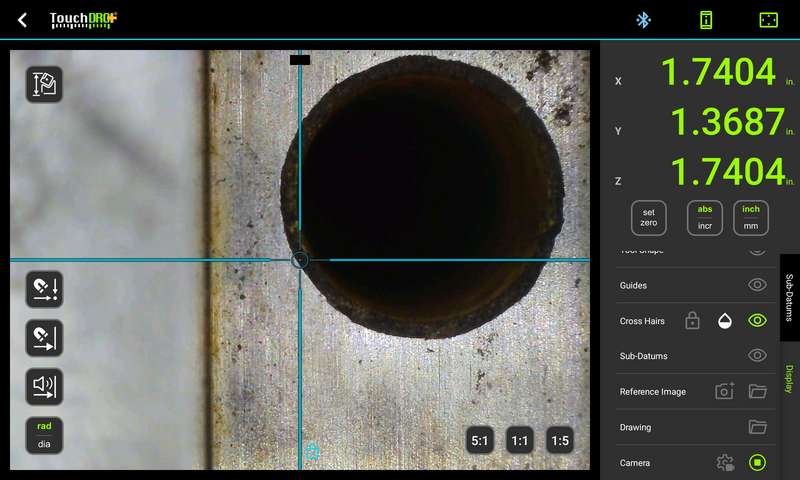 TouchDRO graphical view on a milling machine, showing live microscope video with the crosshairs picking up the edge of a drilled hole