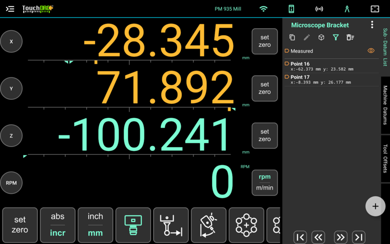 The TouchDRO main display in measurement mode, with mint readouts and the function strip along the bottom