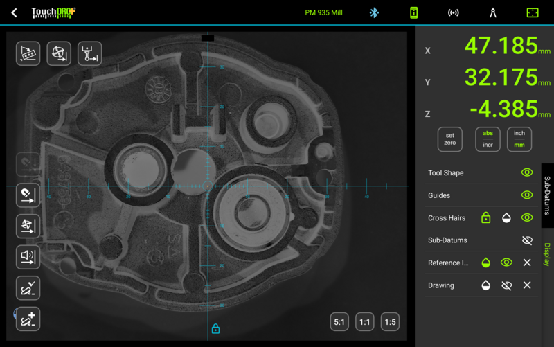 A photo of the part as the reference overlay: the crosshairs track the spindle over the actual casting.