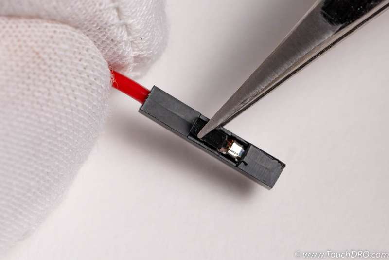 Wire housing can be removed by lifting the tab with sharp tweeers or even a large needle Wire housing can be removed by lifting the tab with sharp tweeers or even a large needle