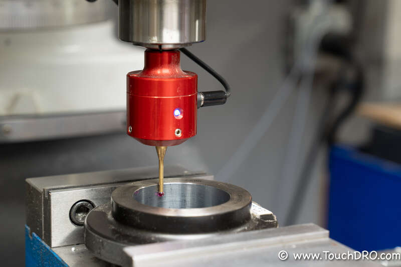Measuring the effective tip diameter of a touch probe against a 2 inch ring gauge Touch probe mounted in a milling machine spindle with its stylus inside a 2 inch ring gauge during TouchDRO tip diameter calibration