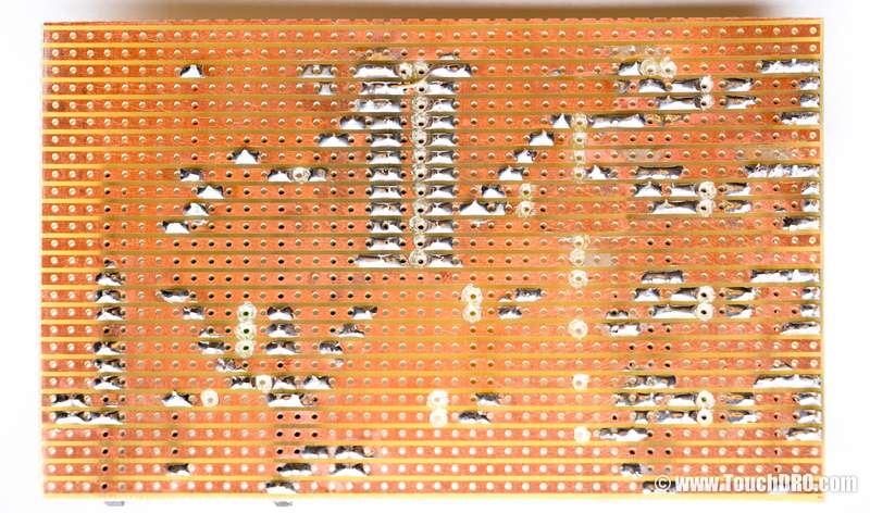 Bottom side of DIY DRO stripboard showing routed traces and jumpers