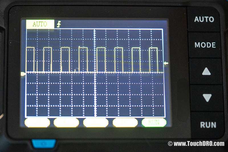 Oscilloscope trace showing two-level square-wave switching — indicates a differential pair