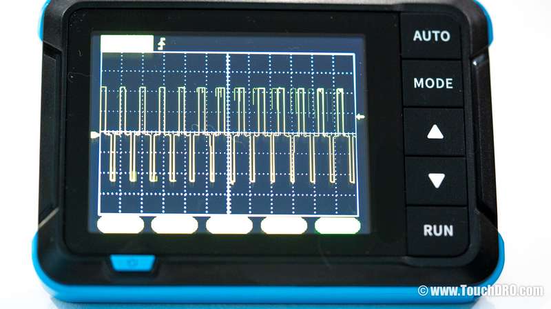 Oscilloscope trace showing a three-level pattern (+5V, 0V, -5V) — indicates a quadrature pair, not a differential pair